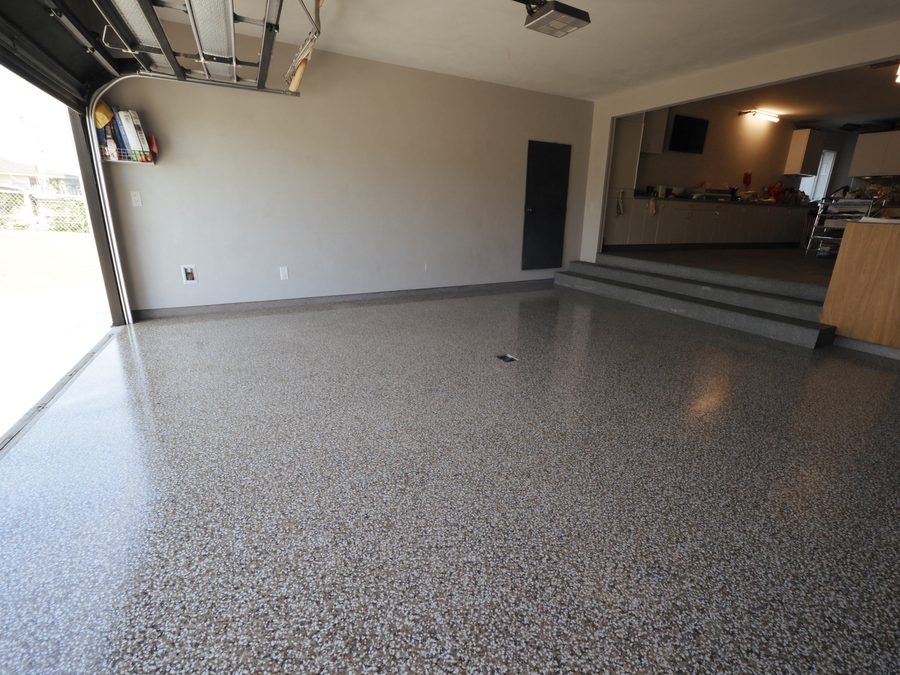 Flake epoxy floor in a residential garage with a glossy topcoat
